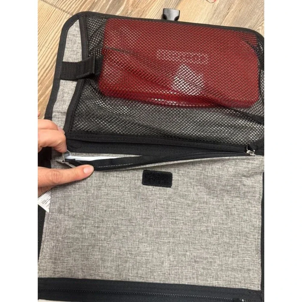 Travel diaper clutch and changing pad